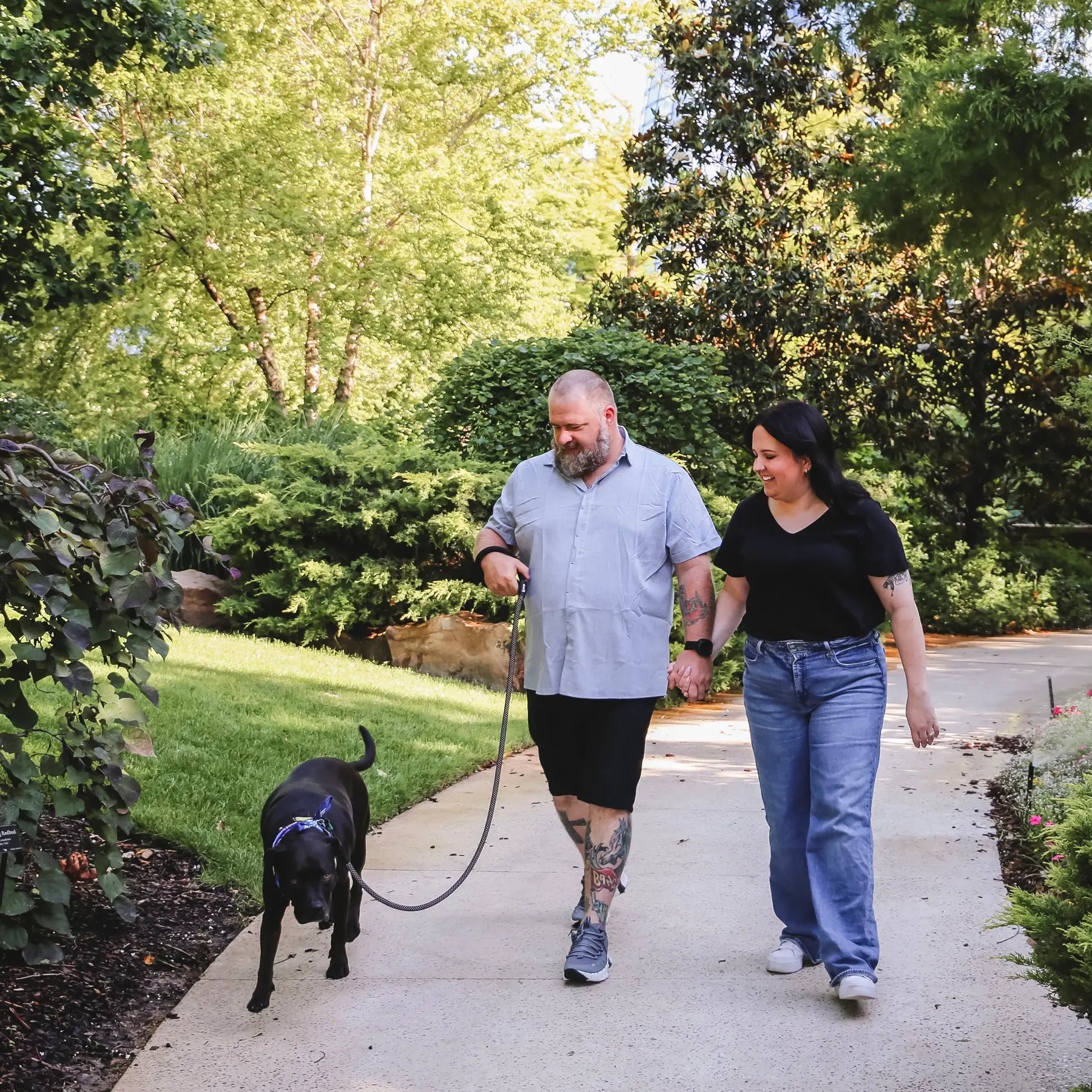 Couple walking dog