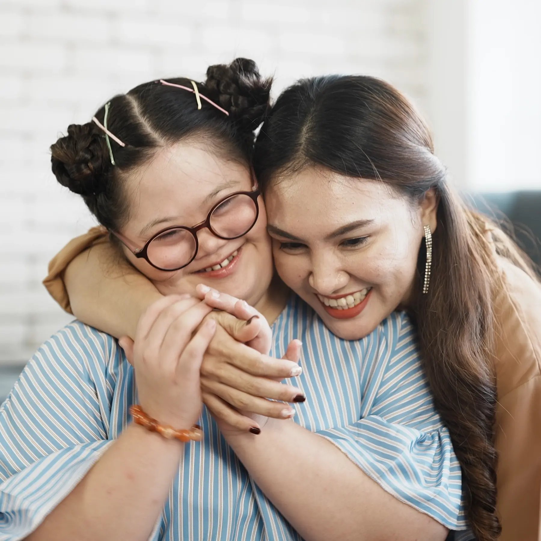 Two women family members hugging