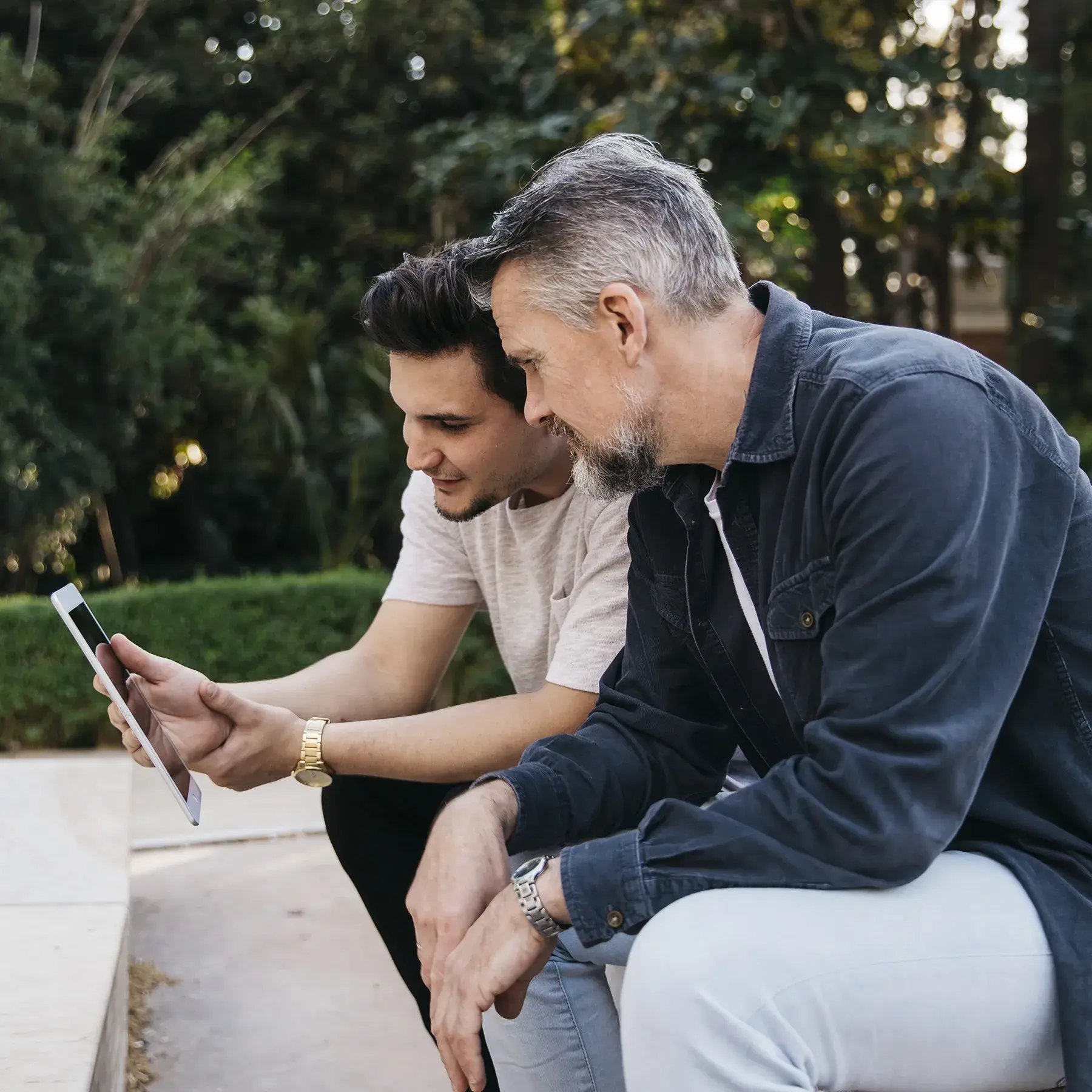 father-son-using-tablet