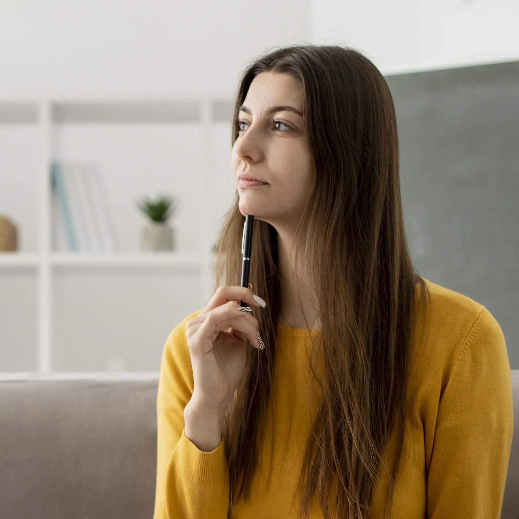 woman-on-couch-thinking-about-credit-scores