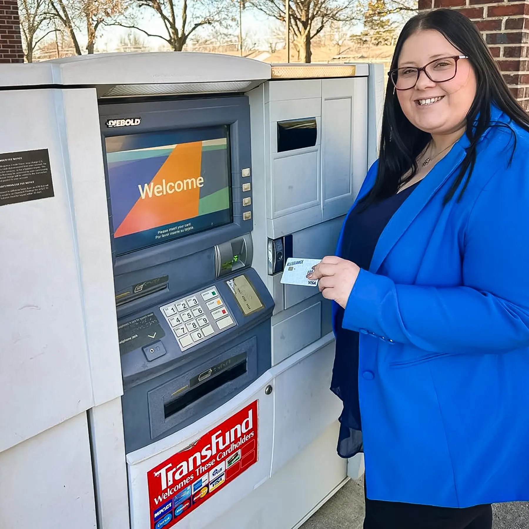woman using Allegiance debit card at surcharge-free ATM