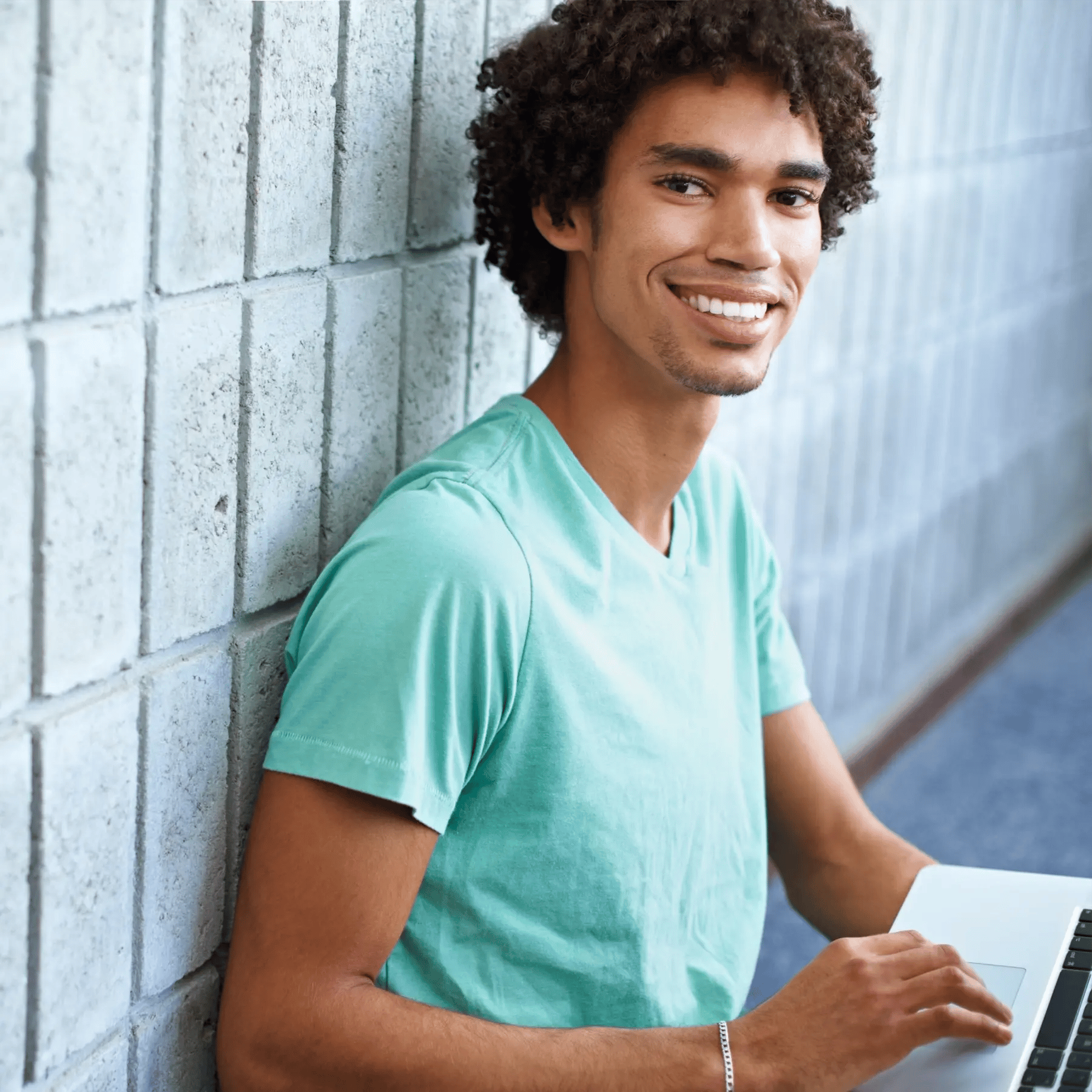First time car buyer loan applications are simple to complete shown by this african american young man on his laptop.
