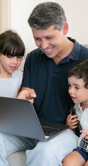great-loan-rates-at-allegiance-credit-union-are-affordable-man-with-two-children-looking-at-laptop