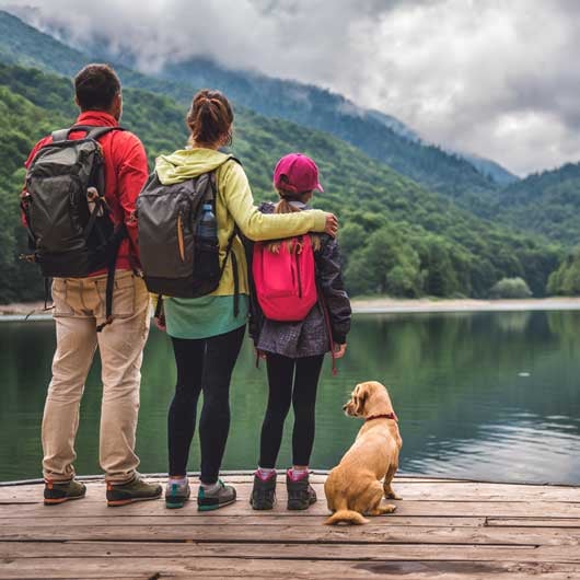 travel-credit-card-rewards-helped-this-family-standing-on-dock-at-lake-vacation-together