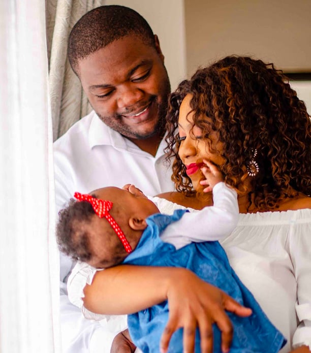 parents looking at their baby with joy