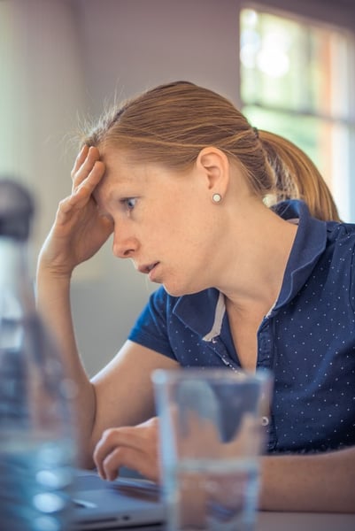 Woman frustrated with money management on computer Woman frustrated with money management on computer