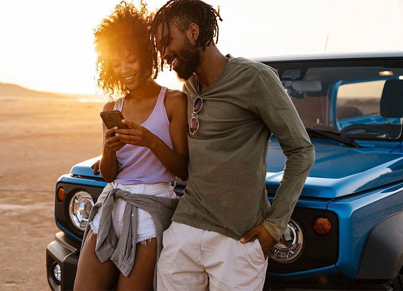 joyful-couple-using-allegiance-mobile-banking-on-their-mobile-phone