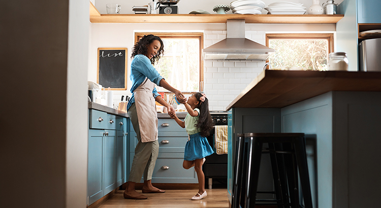 Mom and Daughter dancing in the kitchen