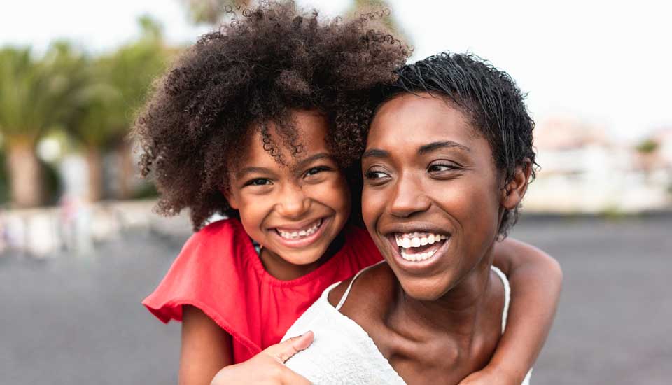 A heloc or home equity line of credit is flexible mom and daughter smiling.