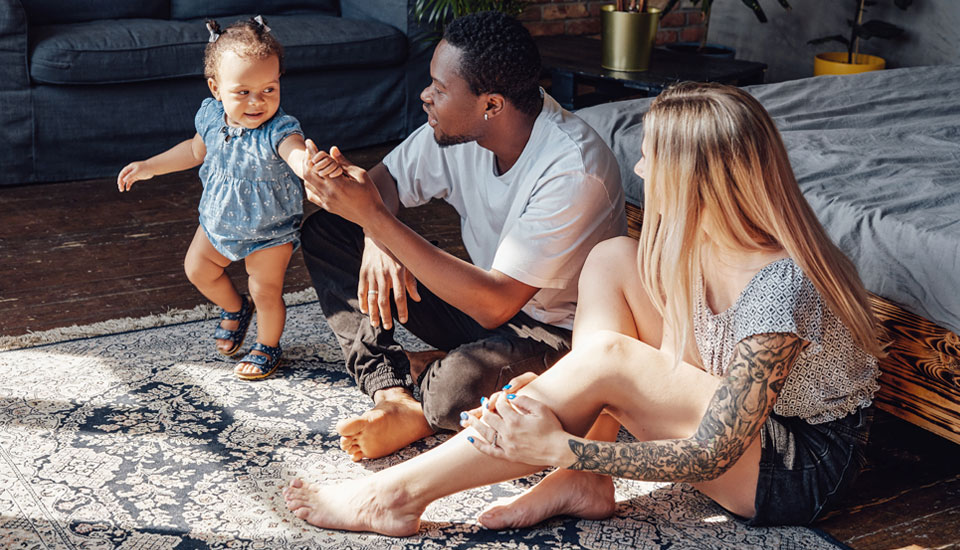 Personal-loans-can-help-people-of-all-ages-enjoy-like-this-husband-and-wife-sitting-and-paying-on-the-floor-with-their-daughter.