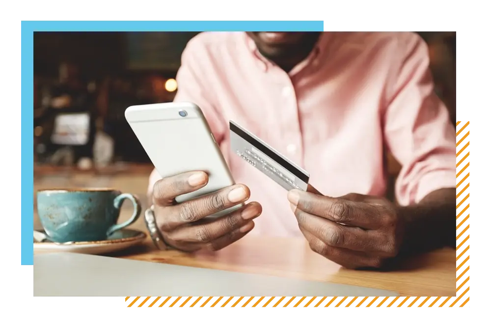 Male using business credit card at coffee shop