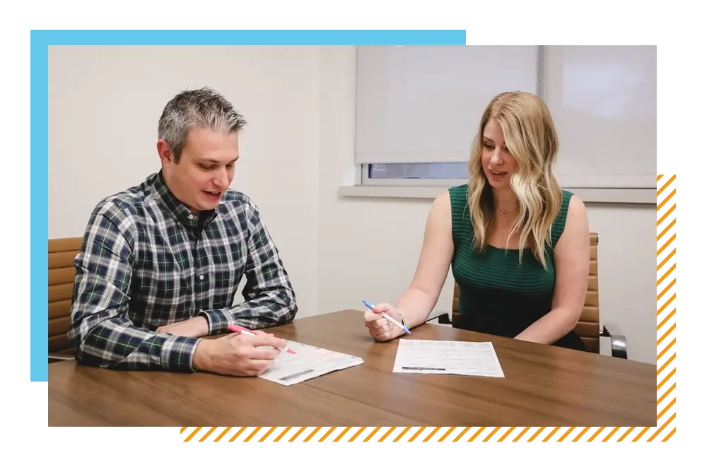Product Feature_man and woman signing documents