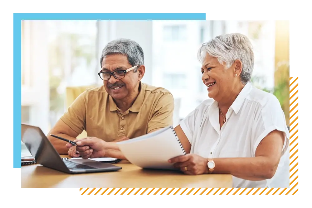 Product Feature_older couple on computer with notebook Product Feature_older couple on computer with notebook