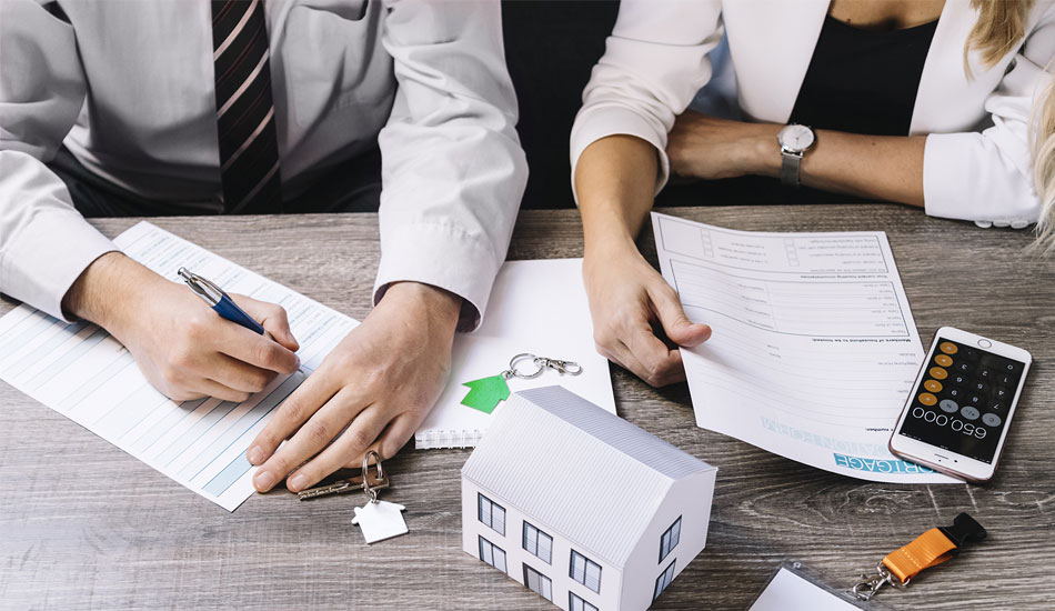 Couple discussing a home equity loan and calculating the potential savings they may encounter. 