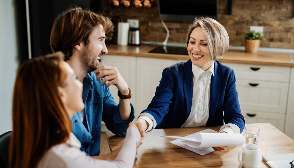 Allegiance-Credit-Union-members-picked-credit-union-vs-bank-when-it-came-to-their-mortgage-while-shaking-hands-with-mortgage-officer.