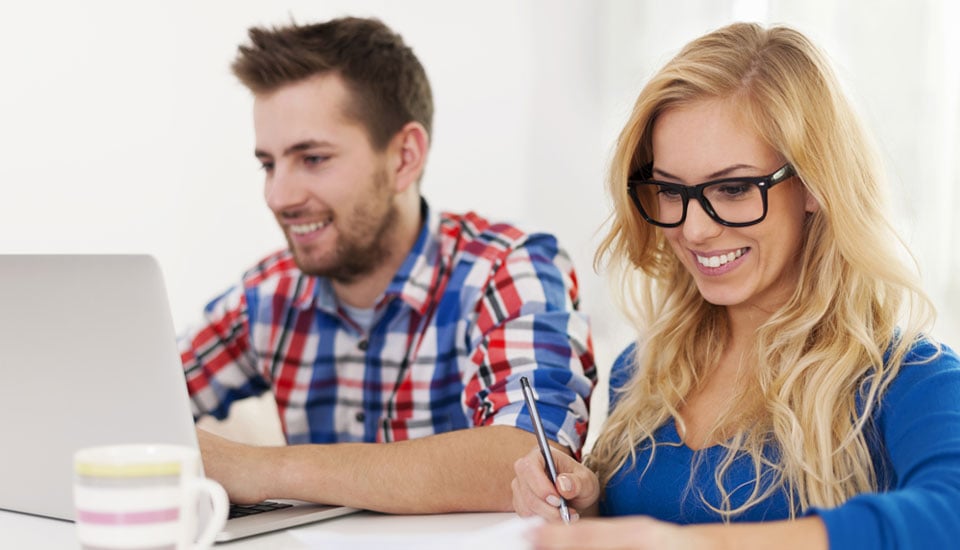 Couple-researching-credit-union-vs-bank-differences-on-laptop-to-decide-which-is-right-for-them.