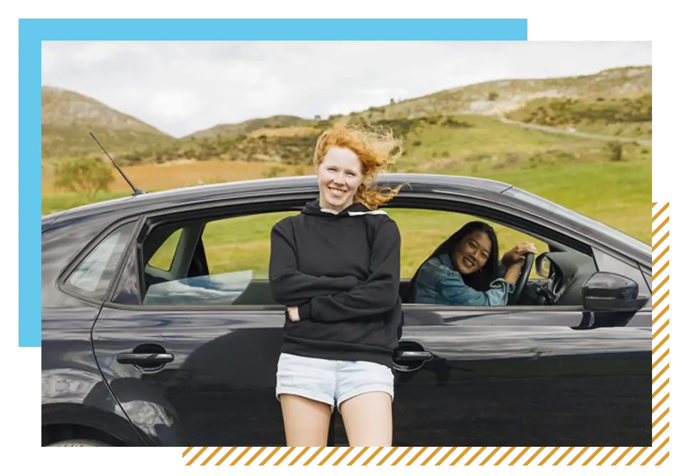 Young girls driving away after a first time car buyer loan approval came through.