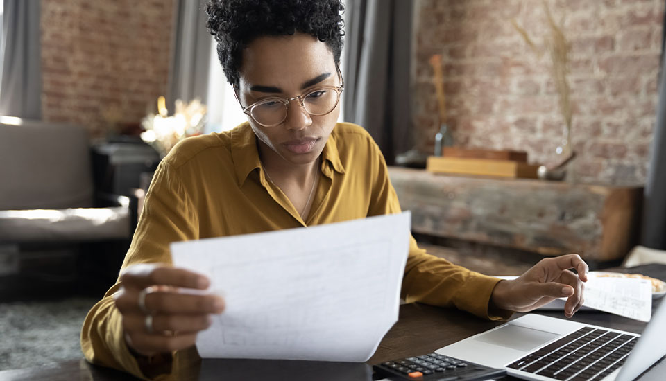 woman reviewing insurance hacks that will help her shop around and find a better deal