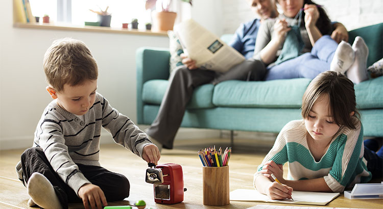 kids playing and drawing in living room