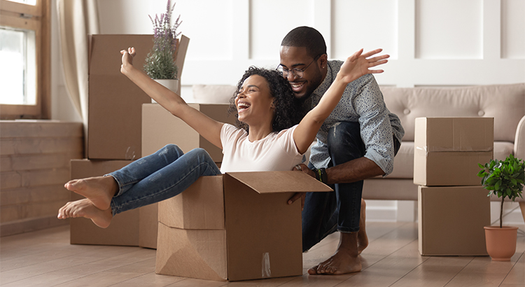 African American couple playing with moving boxes