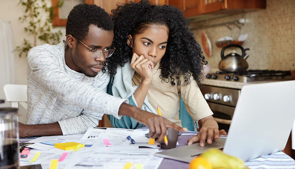 couple analyzing personal finance budget