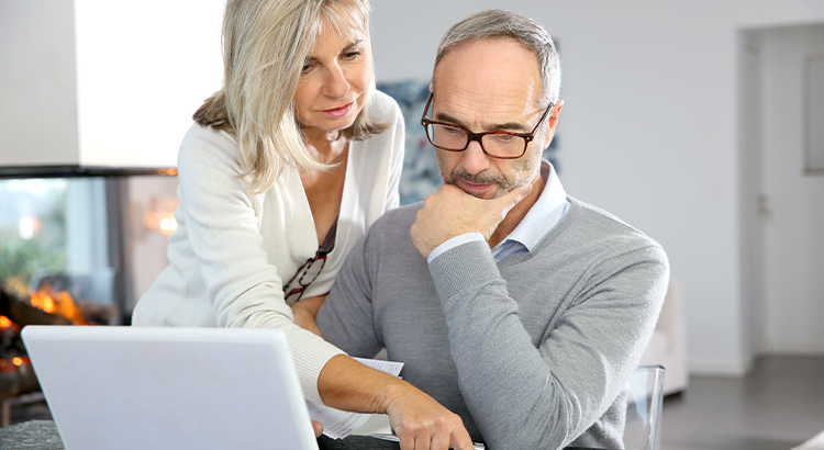 older couple looking over papers