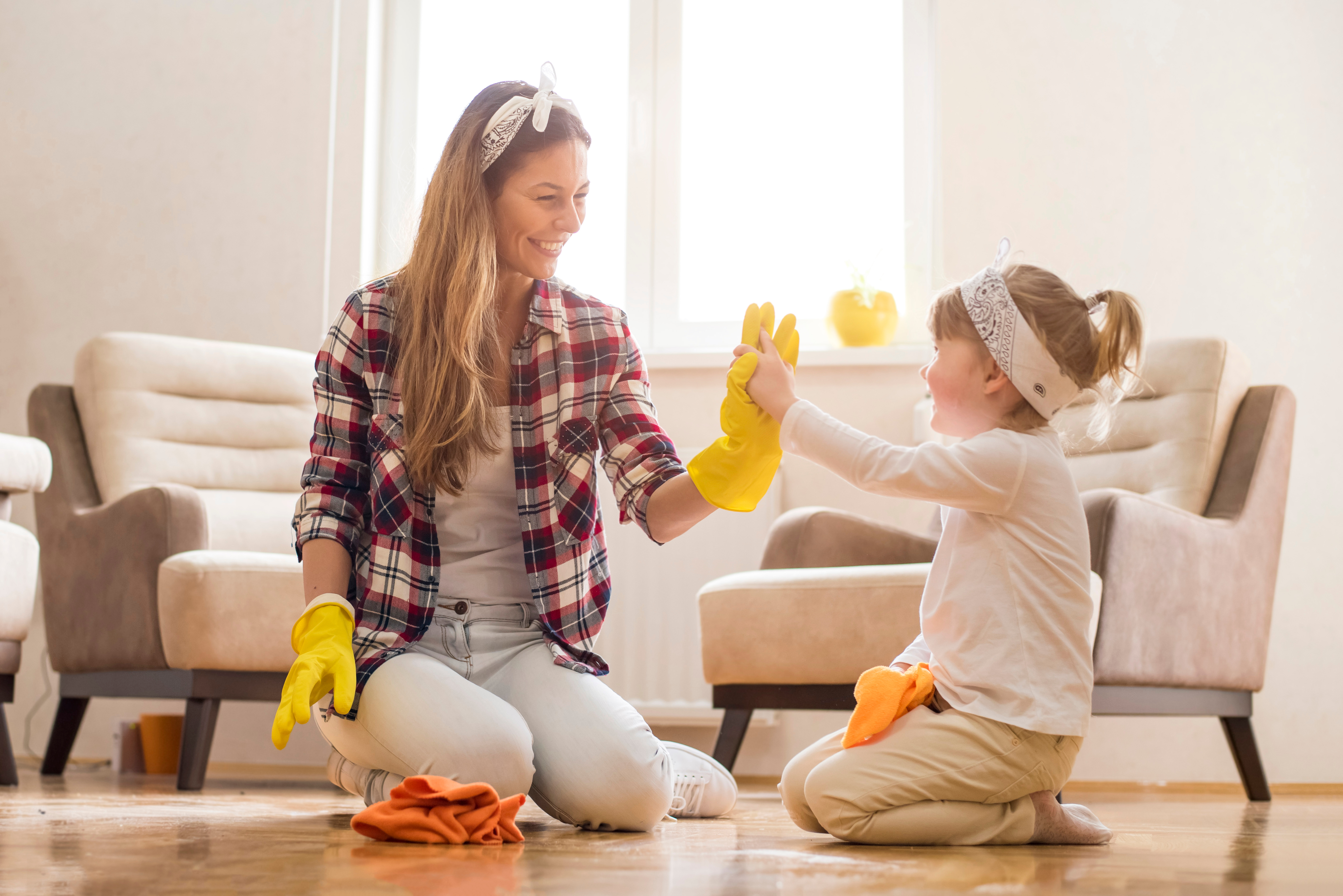 women and child high fiving 