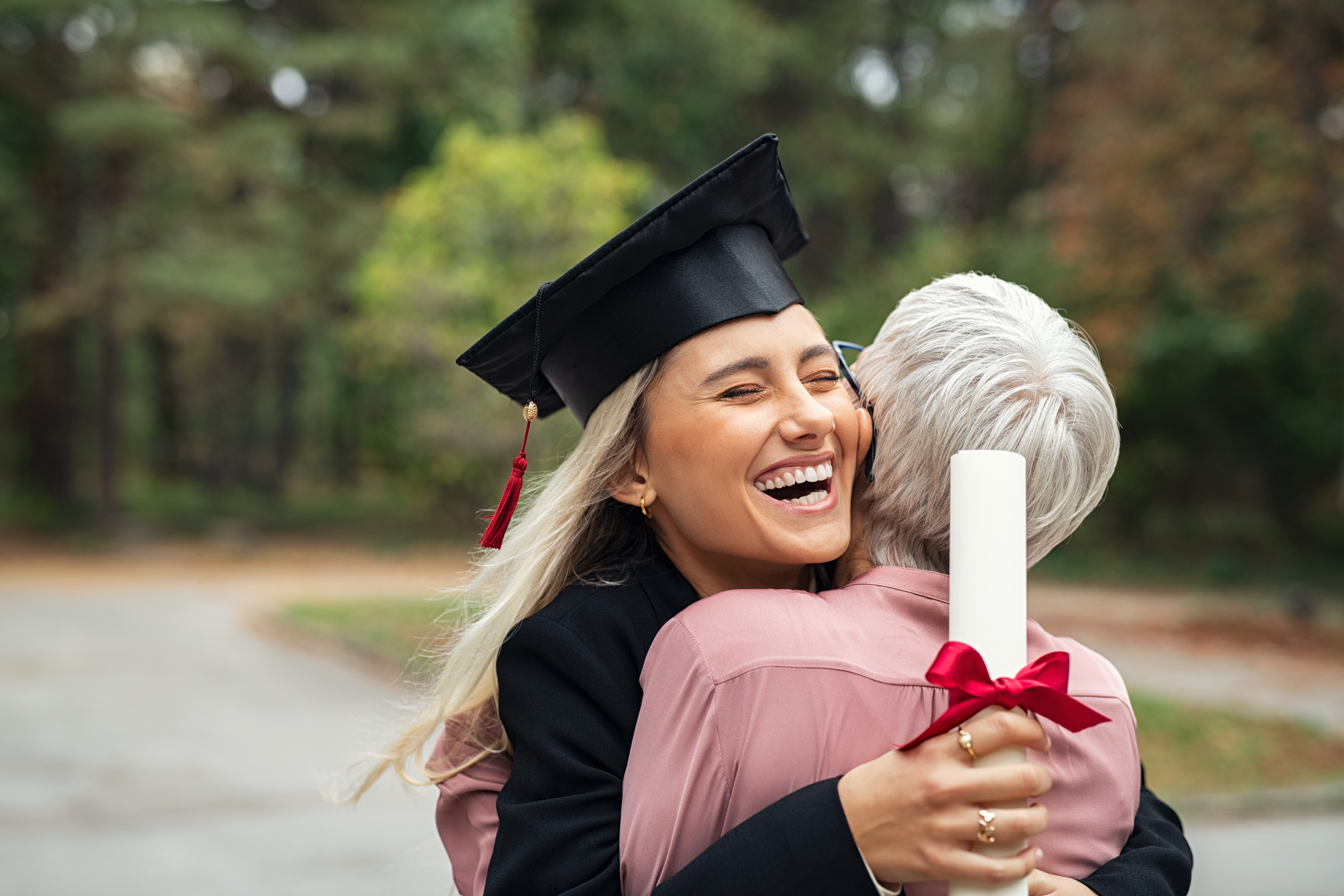 college graduate hugging grandmother