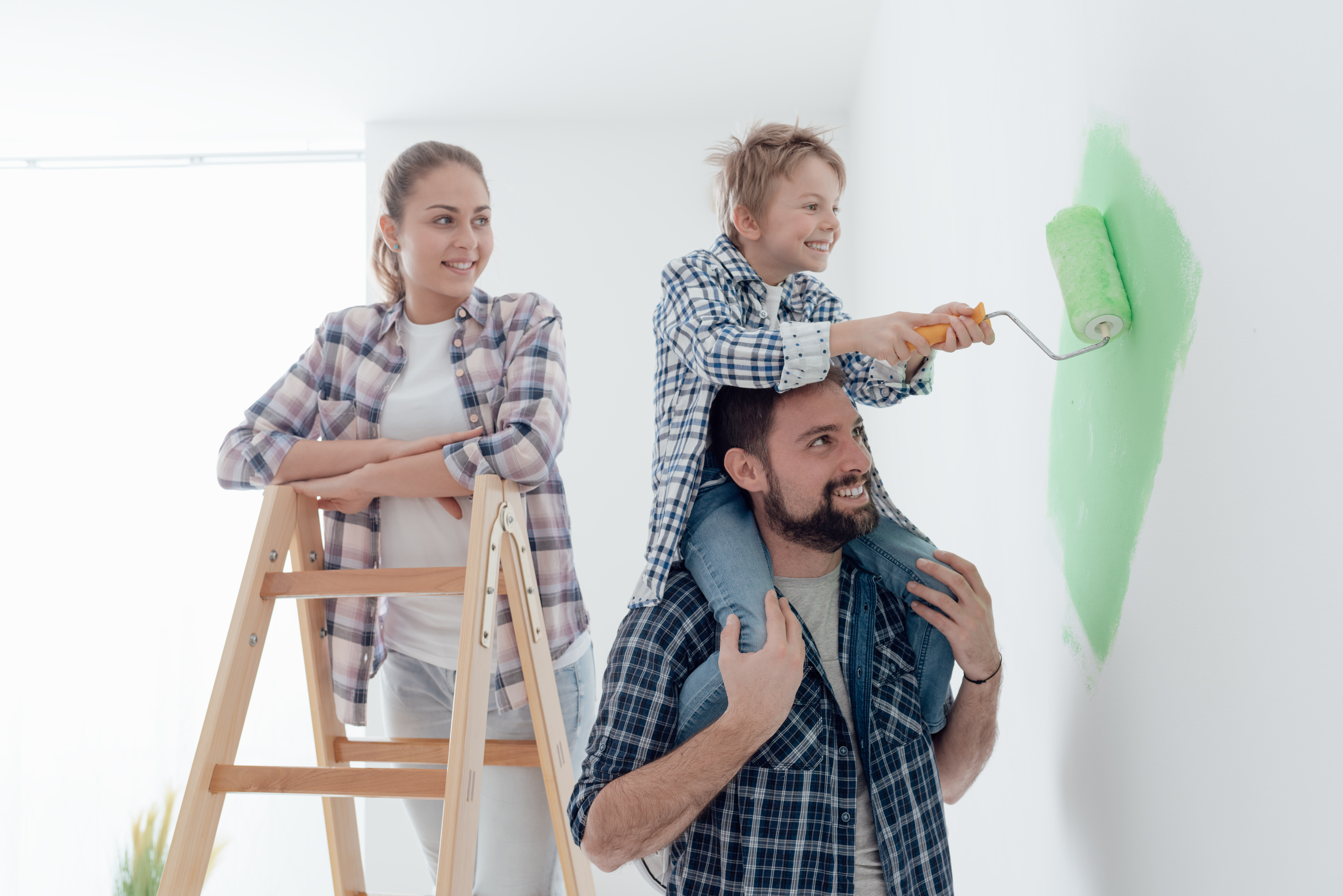 family painting the walls