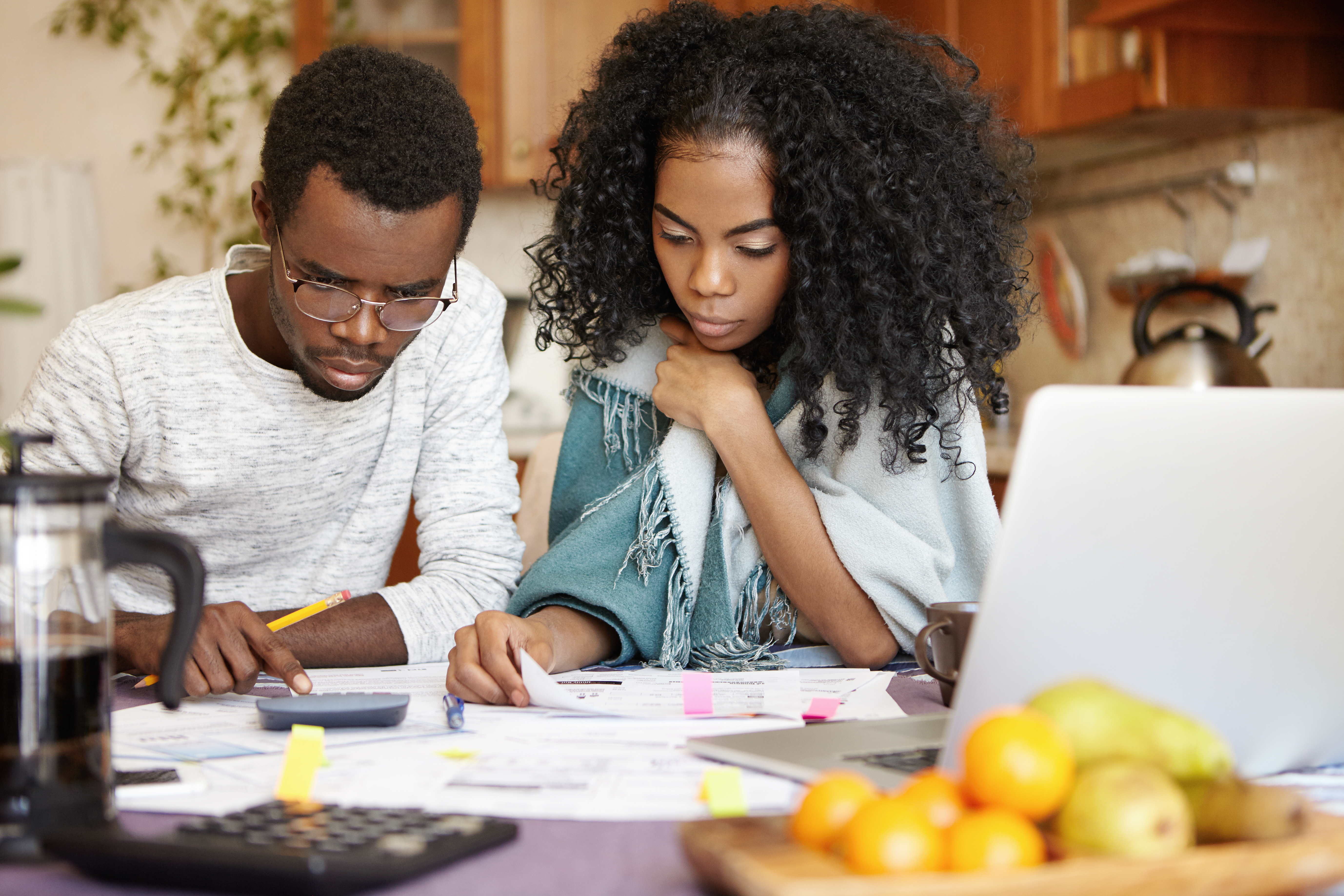 man and woman looking at paperwork